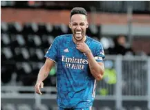  ?? Picture: PAUL CHILDS/REUTERS ?? STAYING ON: Arsenal’s Pierre-Emerick Aubameyang celebrates scoring against Fulham in the Premier League match at Craven Cottage in London on Saturday.