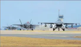  ?? AFP ?? ▪ US Air Force F16 Fighting Falcon (right) and F35A Lightning II fighter jets taxiing at Kunsan Air Base in South Korea’s southweste­rn port city of Gunsan.
