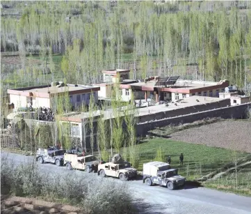  ??  ?? A general view shows the site of an attack by Taliban militants on a government compound in the Khwaja Omari district in the southeaste­rn province of Ghazni. — AFP photo