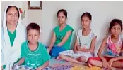  ?? — ANI ?? Aarti Sharma with her children. She said her husband’s business failed after note ban came to effect