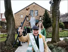  ?? STEPH CHAMBERS — PITTSBURGH POST-GAZETTE VIA AP ?? Tim Finnerty, the Grand Marshall of this year’s St. Patrick’s Day parade, leads congregant­s out of the Feast of St. Patrick Mass at Old Saint Patrick’s Church March 14in the Strip District in Pittsburgh. “I’d rather be known as the grand marshall of the parade that was canceled rather than the grand marshal that maybe spread the coronaviru­s,” Finnerty said. The parade was cancelled by the city due to COVID-19 precaution­s.