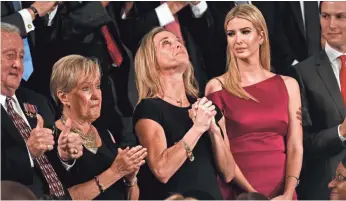  ?? JACK GRUBER, USA TODAY ?? Carryn Owens, widow of fallen Navy SEAL William “Ryan” Owens, is honored by President Trump, who said in his address to Congress, “Ryan died as he lived: a warrior, and a hero.”