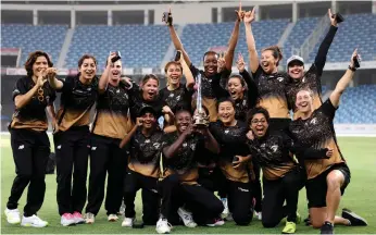  ?? AFP ?? Tornadoes’ players celebrate with the FairBreak Invitation­al trophy after their win