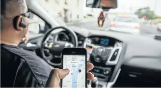  ?? Picture: BLOOMBERG ?? DIGITAL AGE: Partnershi­ps between corporatio­ns and start-ups based on innovative technologi­es, such as Uber, are fast gaining ground, but how will unskilled people fit in?