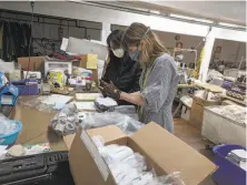  ?? Courtesy Amy Kuschel ?? San Francisco fashion designer Amy Kuschel (right) and Karla Fix make cloth masks that can be worn over N95 masks.