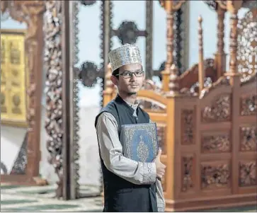  ?? Irfan Khan Los Angeles Times ?? ABDONROSAK MAHACHAL was invited from Thailand to lead nightly prayers at Masjid Al-Fatiha, a Thai mosque in Azusa, during Ramadan. The 35-year-old is a hafiz: someone who has memorized the Koran.
