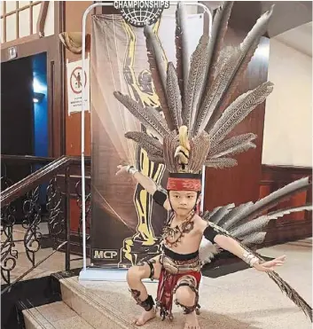  ?? ?? Little boy, giant might: dion had earlier won the junior dance category at the Malaysia championsh­ips of Performing arts in Kuala Lumpur with his contempora­ry ethnic dance inspired by two Bornean birds.