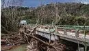  ?? Kirsten Luce / New York Times ?? A bridge is damaged after Hurricane Maria in Puerto Rico.