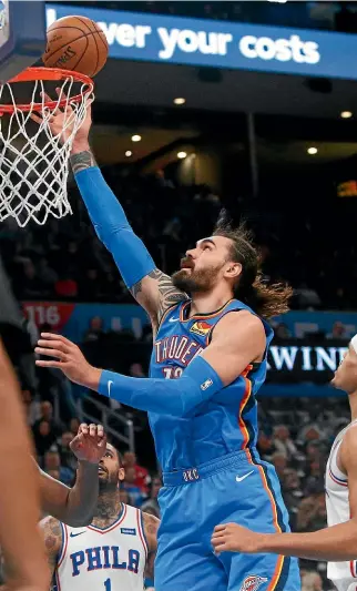  ??  ?? Oklahoma City Thunder centre Steven Adams sinks a basket during yesterday’s NBA match against the Philadelph­ia 76ers.