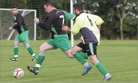  ??  ?? Martin Kehoe of Cloughbawn is tracked by Crossabeg’s Joe Wilson during their Division 2 match on Sunday.