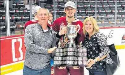  ?? FACEBOOK PHOTO ?? Mitchell Balmas, centre, stands with his parents, Brad and Melanie Balmas, following the championsh­ip game of the MasterCard Memorial Cup in Regina, Sask., on May 27. Balmas captured the Memorial Cup title with the Acadie-Bathurst Titan. The...