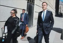  ?? PATRICK DOYLE THE CANADIAN PRESS ?? Finance Minister Bill Morneau leaves a press conference after speaking about the Trans Mountain Expansion project in Ottawa on Wednesday.