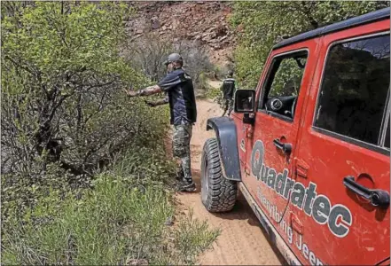  ?? SUBMITTED PHOTO ?? A Quadratec employee helps with trail maintenanc­e in Hey Joe Canyon in Moab, Utah. West Goshen-based Quadratec works with Jeep clubs across the country on environmen­tal projects.