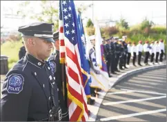  ??  ?? Names of the Greenwich residents lost in the attacks were read aloud, followed by a presentati­on of colors by the Greenwich Police and Boys & Girls Club of Greenwich honor guards and a roseplacin­g at the memorial.