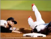  ?? ASSOCIATED PRESS ?? BALTIMORE ORIOLES first baseman Chris Davis (left) tags out Arizona Diamondbac­ks’ Jarrod Dyson for a double play during the fifth inning of a baseball game, Tuesday in Phoenix.