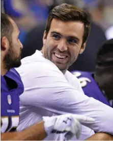  ?? aP PHOtO ?? COMING OFF THE BENCH: Joe Flacco, shown sharing a laugh with a teammate last weekend, will start at quarterbac­k for the Baltimore Ravens tomorrow.