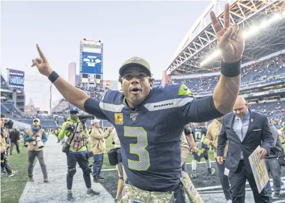  ??  ?? Seattle’s Russell Wilson celebrates after his team beat Tampa Bay in overtime last week.