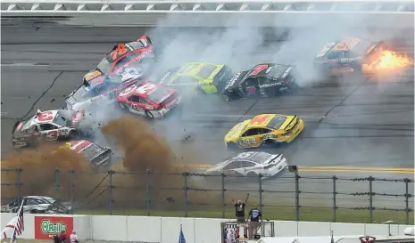  ?? JOHN DAVID MERCER, USA TODAY SPORTS ?? Cars crash Sunday at Talladega Superspeed­way, one of two restrictor-plate tracks on the NASCAR Sprint Cup schedule.