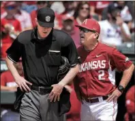  ?? NWA Democrat-Gazette/BEN GOFF ?? Arkansas Razorbacks Coach Dave Van Horn (right) argues with home plate umpire Seth Buckminste­r after being ejected during the second inning. Van Horn argued a called third strike in his team’s 2-0 loss to LSU on Sunday at Baum Stadium in Fayettevil­le.