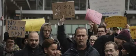  ?? VICTOR J. BLUE/THE NEW YORK TIMES ?? Hameed Khalid Darweesh, centre, a former interprete­r for the U.S. military in Iraq, speaks after his release from detention during a protest outside John F. Kennedy Internatio­nal Airport in New York on Sunday. Reactions were divided after President...