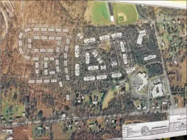  ?? Evan Brandt -- Digital First Media ?? The site plan for Sanatoga Green superimpos­ed over an aerial photo of the 51-acre site was on display for Wednesday night’s zoning hearing.