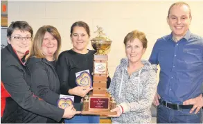  ?? SUBMITTED ?? The Kim Aylward rink of the Silver Fox Entertainm­ent Complex in Summerside won the P.E.I. senior women’s curling championsh­ip on Monday. Aylward edged the Shelley Ebbett entry from the Cornwall Curling Club 6-5 in the final. Members of the winning rink, from left, lead Donna Whelan, second Debbie Caissy, third Shelley MacFadyen and Aylward receive congratula­tions from Curl P.E.I. past president Andrew Robinson.