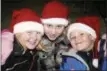  ?? DIGITAL FIRST MEDIA FILE PHOTO ?? Happily waiting on Front Street are, from left, parade-goers Britney Williams, 10, Caity Teilly, 12, and Dominic Williams, 8.