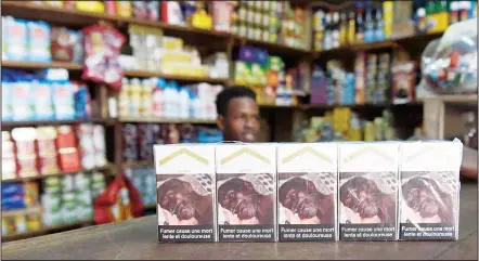  ??  ?? A picture taken on Aug 26, in Dakar shows packs of cigarettes bearing the writing ‘Smoking results in a slow and painful death’ to warn of the dangers of
tobacco consumptio­n.