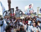  ?? — AFP ?? Thousands of Keralite football fans supporting Argentina cheer at a waterfront in Doha, ahead of the Qatar 2022 Fifa World Cup football tournament.