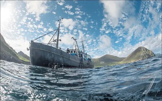  ??  ?? MAKING WAVES: The diving survey vessel MV Halton in Village Bay at St Kilda as divers took the plunge and discovered the hidden wonders in the island’s waters.