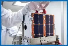  ?? ?? Above: LICIACube will witness DART’s impact with Dimorphos. In this image, a team of engineers inspects the LICIACube at the Johns Hopkins Applied Physics Laboratory