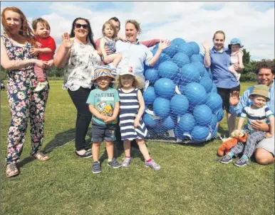  ?? Pictures: John Westhrop FM3873118 ?? Parents and children who joined Jade and Dan Lock, centre, in a balloon release to raise money for the charity Stillbirth and Neonatal Death Society at the Riverside Children’s Centre in Canterbury