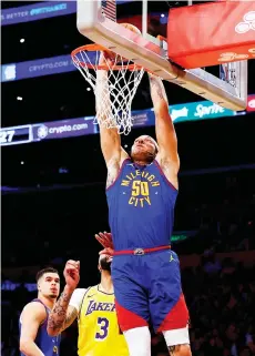  ?? — AFP photo ?? Aaron Gordon of the Denver Nuggets makes a slam dunk against the Los Angeles Lakers in the first quarter during game three of the Western Conference First Round Playoffs at Crypto.com Arena in Los Angeles, California.