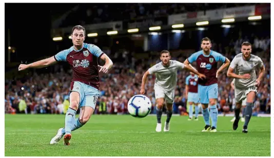  ??  ?? Right on target: Burnley’s Ashley Barnes (left) scoring the third goal against Aberdeen during the second leg of the Europa League qualifying round at Turf Moor on Thursday. — Reuters