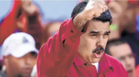  ??  ?? PRESIDENT NICOLAS MADURO at a rally in Caracas to protest against the actions of the Trump administra­tion.