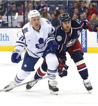  ?? AARON DOSTER/USA TODAY SPORTS ?? Leafs’ Leo Komarov, who scored twice, tangles with Columbus’s Brandon Dubinsky during action Friday in Ohio.