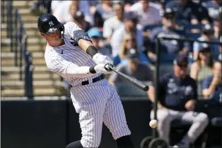  ?? DAVID J. PHILLIP — THE ASSOCIATED PRESS ?? Yankees’ Aaron Judge (99) swings for a strike during the second inning of a spring training baseball game against the Atlanta Braves on Sunday.