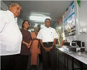  ??  ?? Better tools: Subramania­m (right) with Dr K. Devi (left) examining the new instrument­s at the Integrated Holistic Therapy Centre.