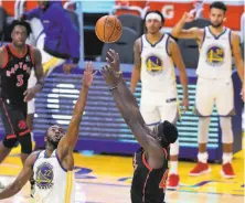  ?? Photos by Carlos Avila Gonzalez / The Chronicle ?? Andrew Wiggins ( left) defends Pascal Siakam’s lastsecond shot. A late foul helped the Warriors pull out a home win.