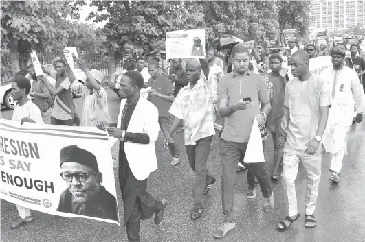  ?? PHOTO: Felix Onigbinde ?? Protesters carry placards to demand that President Mohammadu Buhari resume work or resign in Abuja yesterday.