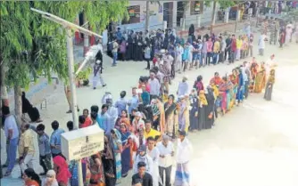  ?? ANI ?? Voters gathered in a queue to cast their vote at polling booth in Varanasi on Sunday.