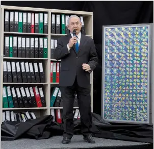  ?? AP/SEBASTIAN SCHEINER ?? Israeli Prime Minister Benjamin Netanyahu presents material on Iranian nuclear weapons developmen­t during a news conference Monday in Tel Aviv, Israel.