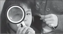  ?? ?? Jinzi, her youngest daughter. Under the photo, Jiu’er writes: “Jinzi, even if you put on magnifying glasses, your eyes are still not as big as your mom’s.”