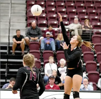  ?? Bud Sullins/Special to Siloam Sunday ?? Siloam Springs junior Katie Kendrick hits the ball Tuesday against Alma as junior Annabelle Van Asche looks on. Siloam Springs swept Alma and then went on the road and swept Russellvil­le on Thursday.