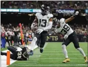  ?? JONATHAN BACHMAN — GETTY IMAGES ?? Jacksonvil­le's Christian Kirk scores on a 44-yard pass play with 3:08left for the winning points at New Orleans.