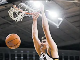  ?? CLIFF JETTE/AP ?? Reigning Big Ten player of the year Luka Garza is back for Iowa.