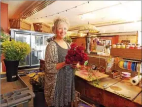  ?? LISA MITCHELL - DIGITAL FIRST MEDIA ?? Shawn Brown, owner of Jackie &amp; Daughter Flower Shop in Kutztown, recently participat­ed in the AIFD, profession­al floral design evaluation in California. Brown is now a certified floral designer.