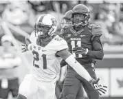  ?? Richard W. Rodriguez / Tribune News Service ?? TCU running back Kyle Hicks, left, celebrates one of five touchdowns he scored against Baylor at McLane Stadium on Saturday.