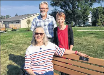  ??  ?? Cynthia Roberts (sitting) attended Grade 1 at Milton School with Miss Sweeny as her teacher in 1941/1942. Kay Ladd, a well-known Yarmouthia­n who was raised on a clipper ship, was a friend of hers for three generation­s. “That’s why the bench,” she said. Park committee members David Sollows and Jean Clulee stand behind.