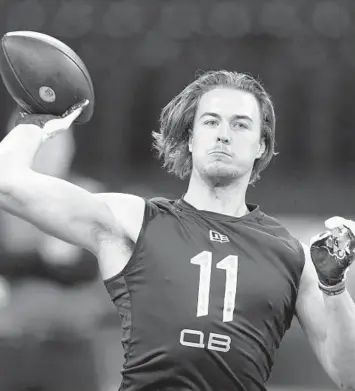  ?? DARRON CUMMINGS/AP ?? Pittsburgh quarterbac­k Kenny Pickett throws at the NFL scouting combine March 3 in Indianapol­is.